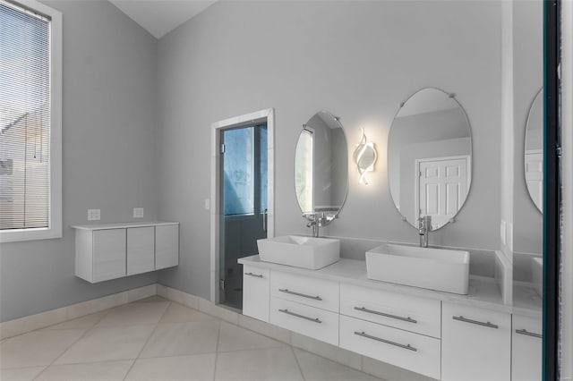 237 Kensington Ln, Cape Girardeau, MO 63701 - full bath featuring double vanity, tile patterned flooring, and baseboards