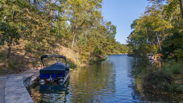 2471 Alpine Cove Dr, Innsbrook, MO 63390 - water view featuring boat lift, a boat dock, and a heavily wooded area