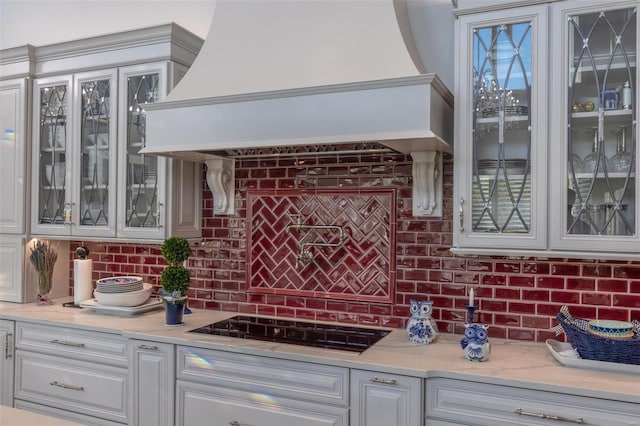 2471 Alpine Cove Dr, Innsbrook, MO 63390 - bar with custom exhaust hood, black cooktop, and tasteful backsplash