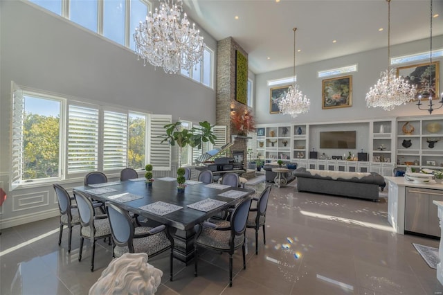 2471 Alpine Cove Dr, Innsbrook, MO 63390 - dining area with a chandelier, a high ceiling, tile patterned flooring, healthy amount of natural light, and recessed lighting