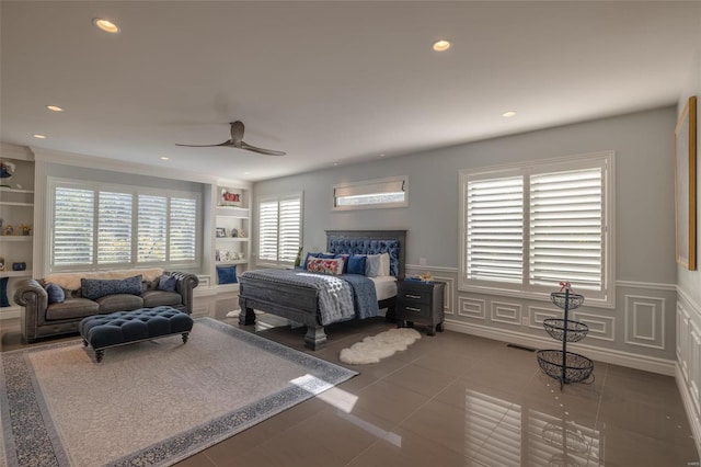 2471 Alpine Cove Dr, Innsbrook, MO 63390 - tiled bedroom featuring recessed lighting, wainscoting, a decorative wall, and ceiling fan