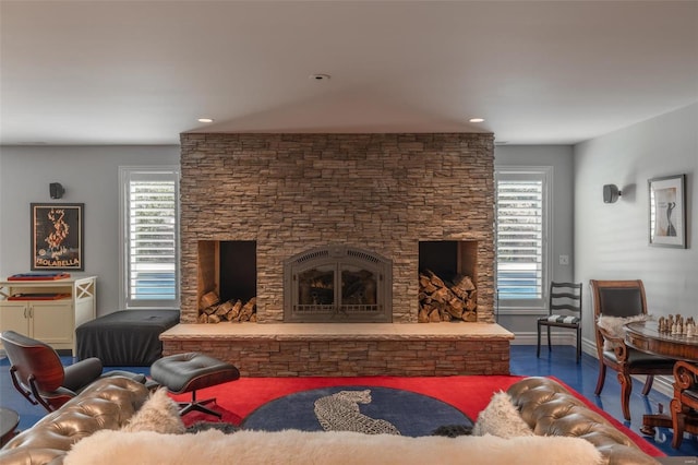 2471 Alpine Cove Dr, Innsbrook, MO 63390 - living room featuring a fireplace, wood finished floors, baseboards, and recessed lighting
