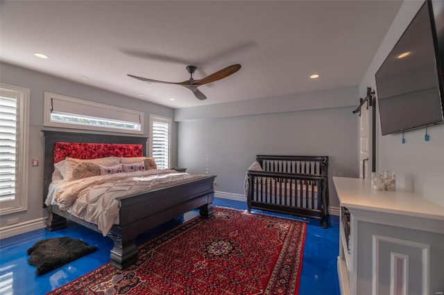 2471 Alpine Cove Dr, Innsbrook, MO 63390 - bedroom with a barn door, baseboards, ceiling fan, and recessed lighting