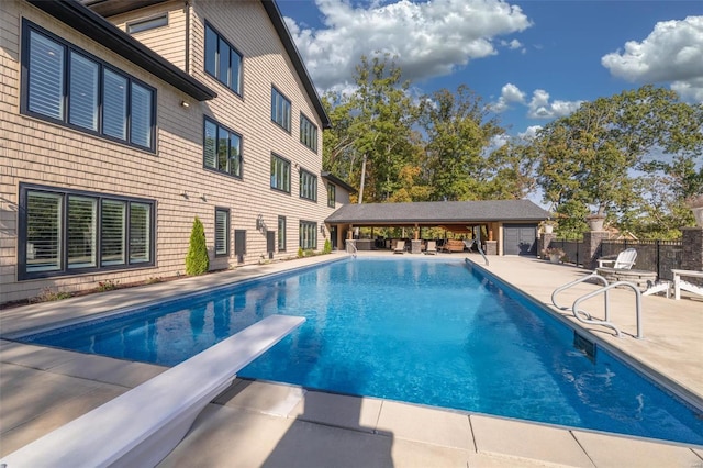 2471 Alpine Cove Dr, Innsbrook, MO 63390 - view of pool with a patio area, fence, and a diving board