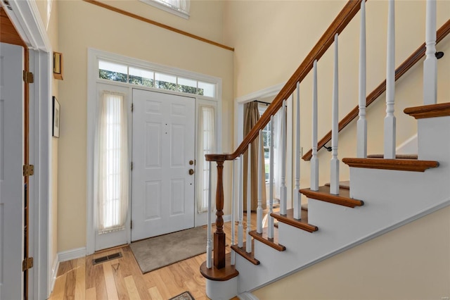 1125 N Franklin St, Litchfield, IL 62056 - entrance foyer with light wood-style floors, stairway, baseboards, and a high ceiling
