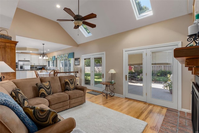 1125 N Franklin St, Litchfield, IL 62056 - living room with a skylight, ceiling fan, high vaulted ceiling, light wood-type flooring, and recessed lighting