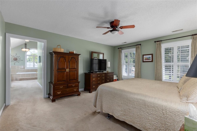 1125 N Franklin St, Litchfield, IL 62056 - bedroom with light carpet, a textured ceiling, baseboards, and ceiling fan
