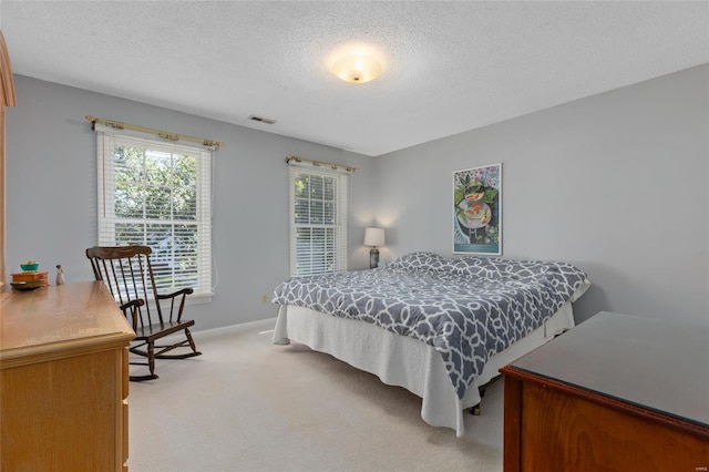 1125 N Franklin St, Litchfield, IL 62056 - bedroom featuring light carpet, a textured ceiling, and baseboards