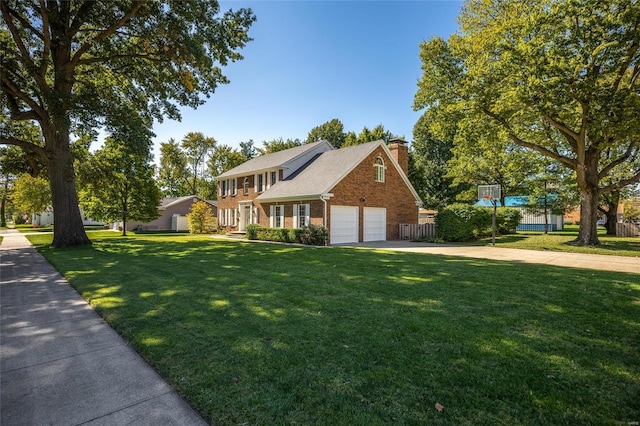 1125 N Franklin St, Litchfield, IL 62056 - colonial home featuring a chimney, brick siding, and driveway