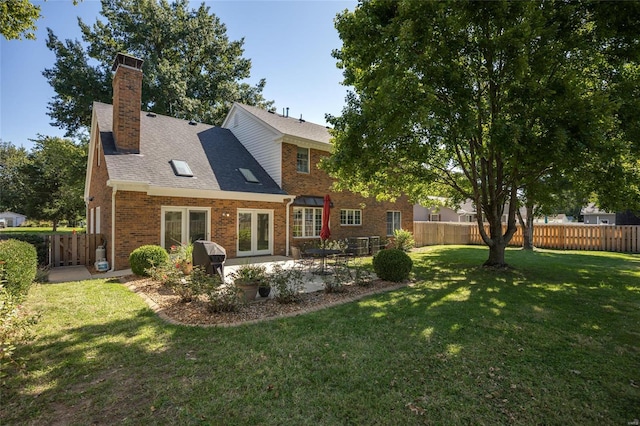 1125 N Franklin St, Litchfield, IL 62056 - rear view of property featuring brick siding, a patio area, french doors, a chimney, and roof with shingles