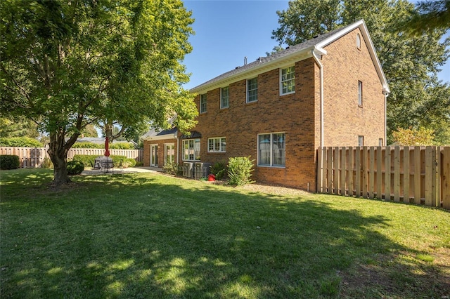 1125 N Franklin St, Litchfield, IL 62056 - rear view of property featuring brick siding and a patio