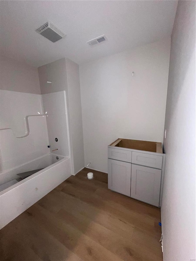 5355 Byrd Creek Trl, Jackson, MO 63755 - bathroom featuring wood finished floors and bathing tub / shower combination