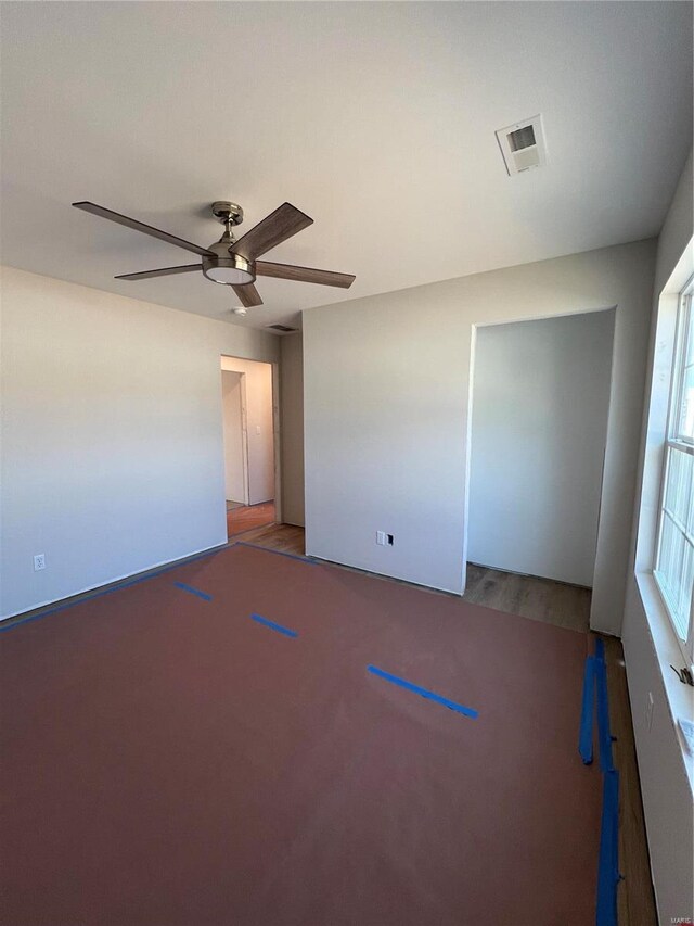5355 Byrd Creek Trl, Jackson, MO 63755 - empty room featuring a ceiling fan and wood finished floors