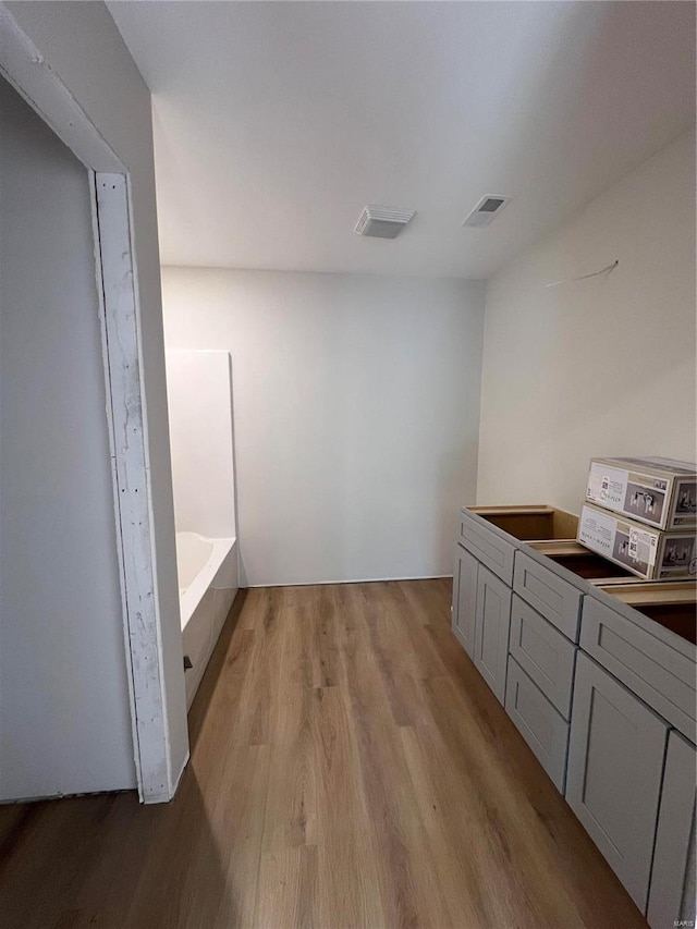 5355 Byrd Creek Trl, Jackson, MO 63755 - full bathroom with wood finished floors and a bathtub
