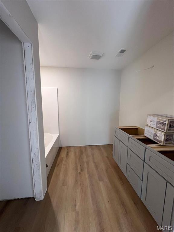 5355 Byrd Creek Trl, Jackson, MO 63755 - bathroom featuring wood finished floors and a bath