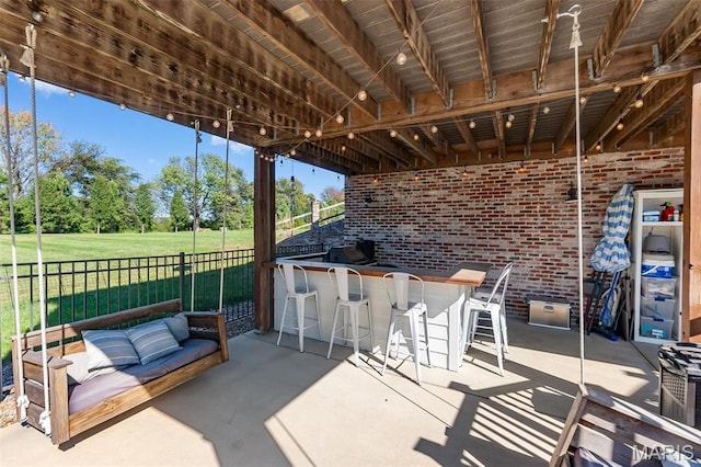 view of patio with an outdoor living space and view of scattered trees