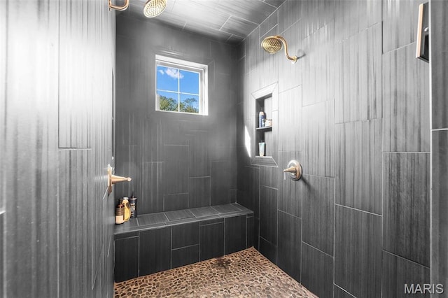 full bath featuring tiled shower