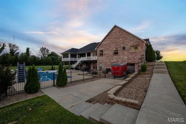165 Kingsborough Ct, Jackson, MO 63755 - back of house featuring stairs, a patio area, brick siding, and a wooden deck