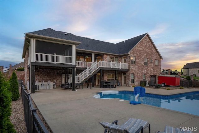 165 Kingsborough Ct, Jackson, MO 63755 - back of property featuring stairs, a patio, brick siding, a wooden deck, and a sunroom