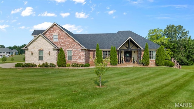 165 Kingsborough Ct, Jackson, MO 63755 - craftsman house featuring a front yard, brick siding, and roof with shingles