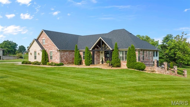 165 Kingsborough Ct, Jackson, MO 63755 - view of front of property with a front yard, brick siding, and roof with shingles