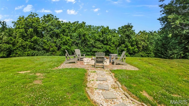 165 Kingsborough Ct, Jackson, MO 63755 - view of grassy yard featuring an outdoor fire pit and a patio