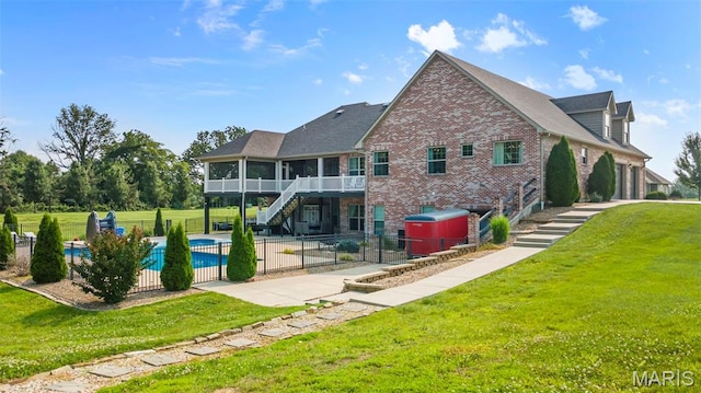 165 Kingsborough Ct, Jackson, MO 63755 - rear view of house with stairway, a sunroom, a patio area, and brick siding