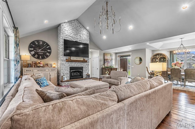 165 Kingsborough Ct, Jackson, MO 63755 - living area with a chandelier, dark wood finished floors, a stone fireplace, recessed lighting, and high vaulted ceiling