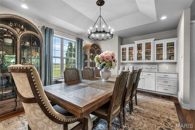165 Kingsborough Ct, Jackson, MO 63755 - dining space with a chandelier, dark wood-type flooring, a raised ceiling, and recessed lighting