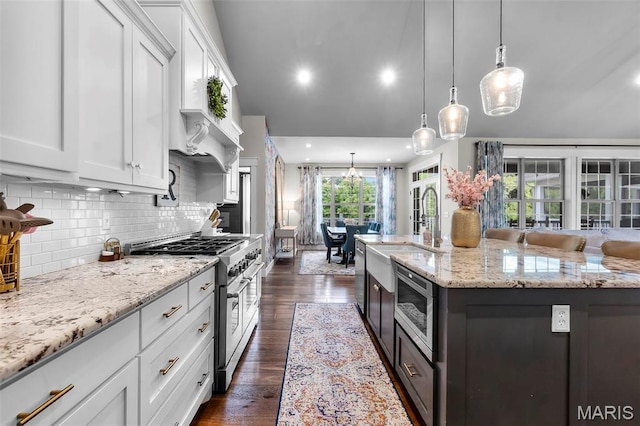 165 Kingsborough Ct, Jackson, MO 63755 - kitchen with stainless steel appliances, white cabinets, light stone countertops, a center island with sink, and recessed lighting