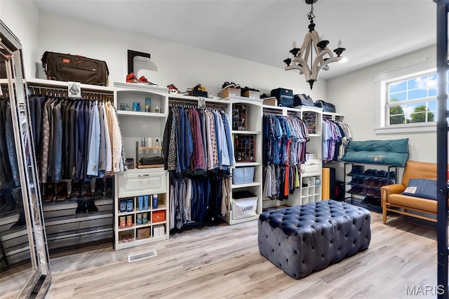 165 Kingsborough Ct, Jackson, MO 63755 - walk in closet with a chandelier and wood finished floors