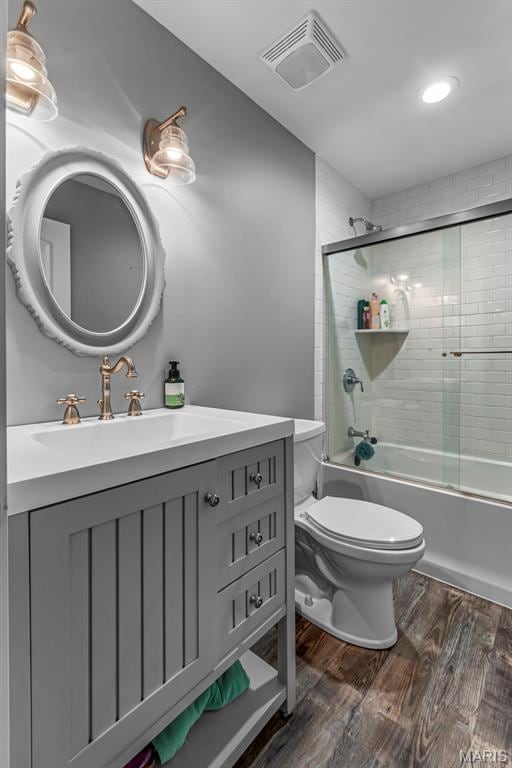 165 Kingsborough Ct, Jackson, MO 63755 - bathroom with vanity, wood finished floors, and combined bath / shower with glass door