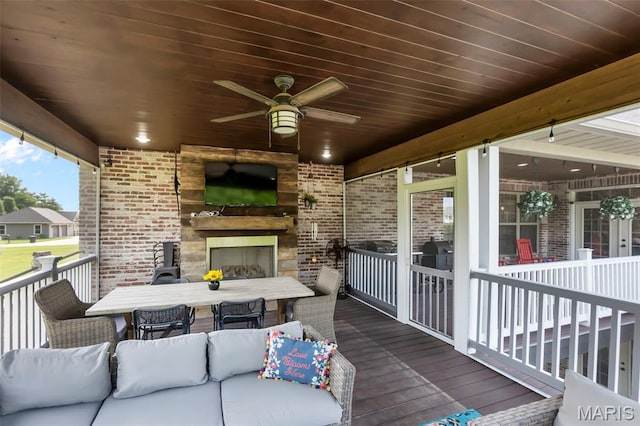 165 Kingsborough Ct, Jackson, MO 63755 - wooden deck with outdoor dining space, ceiling fan, and an outdoor living space with a fireplace