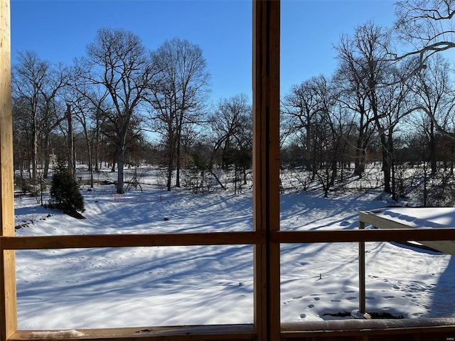 snowy yard featuring fence