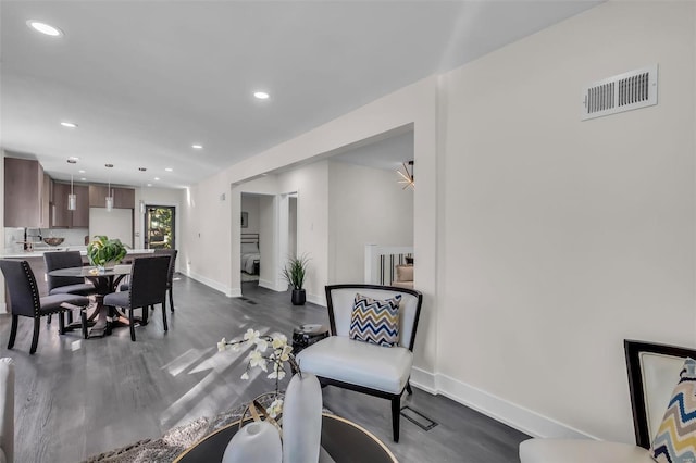 7449 Wayne Ave, Saint Louis, MO 63130 - sitting room featuring dark wood-style floors, baseboards, and recessed lighting