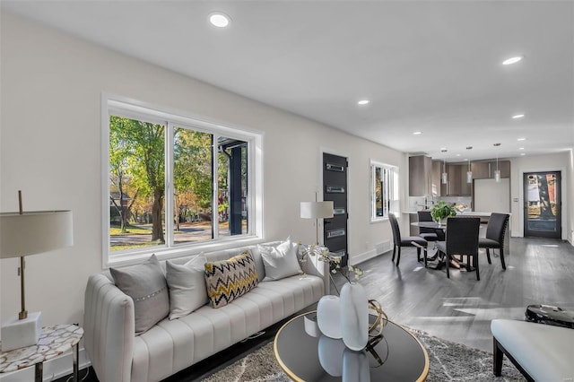 7449 Wayne Ave, Saint Louis, MO 63130 - living area with wood finished floors, recessed lighting, and baseboards