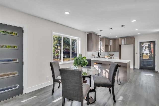 7449 Wayne Ave, Saint Louis, MO 63130 - dining area featuring wood finished floors, baseboards, and recessed lighting