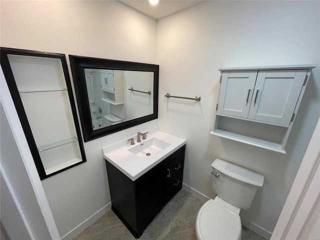 half bathroom with baseboards, toilet, and vanity