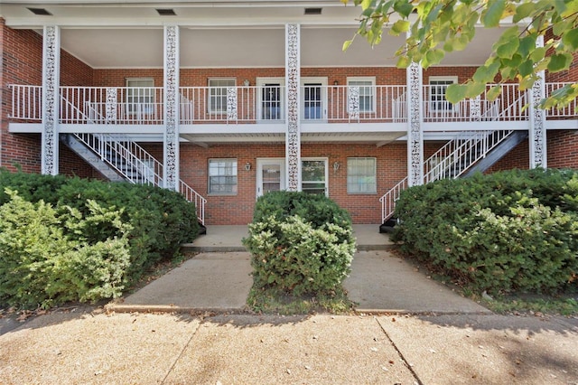 view of property featuring stairway