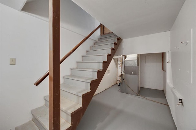 stairway with concrete floors and heating unit