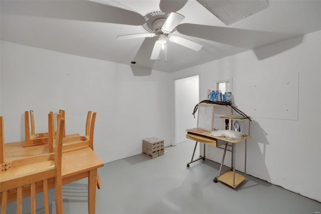 office featuring finished concrete floors and ceiling fan