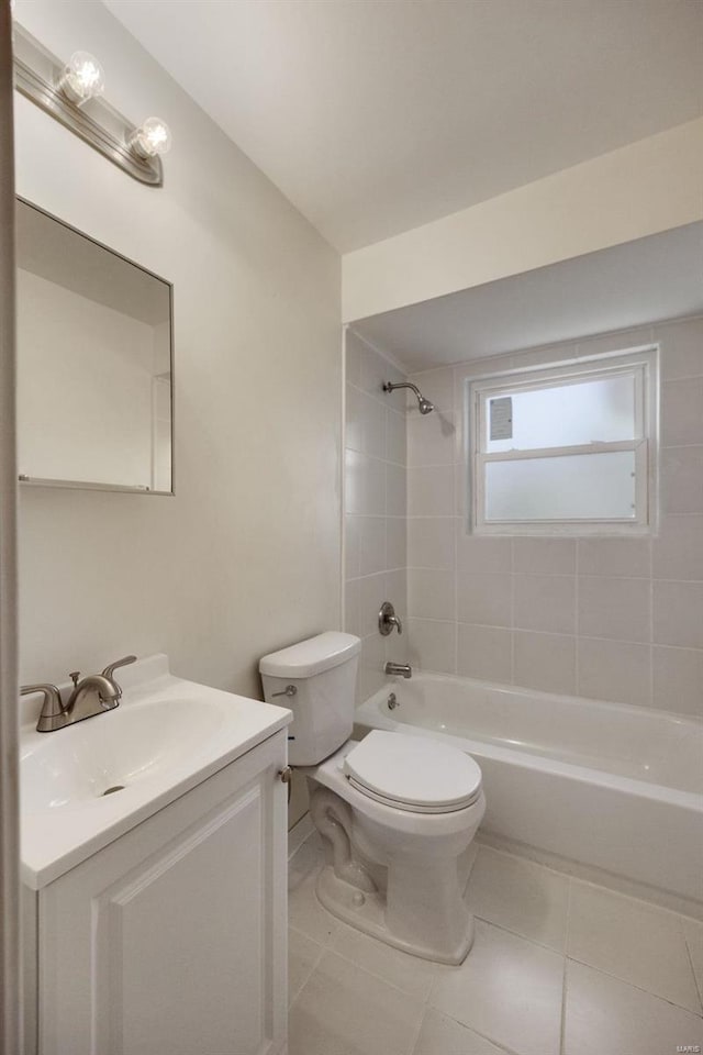 bathroom featuring toilet, vanity, washtub / shower combination, and tile patterned floors