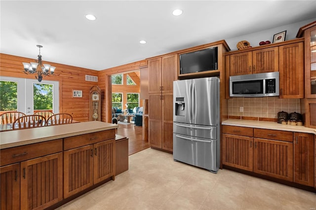 6800 Promise Pt, House Springs, MO 63051 - kitchen with stainless steel appliances, healthy amount of natural light, light countertops, a chandelier, and recessed lighting