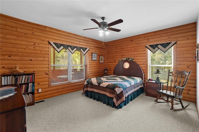 6800 Promise Pt, House Springs, MO 63051 - carpeted bedroom with multiple windows, log walls, and ceiling fan