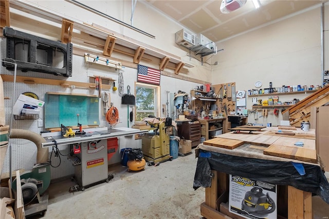 6800 Promise Pt, House Springs, MO 63051 - garage with a workshop area and a garage door opener