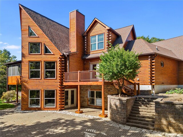 6800 Promise Pt, House Springs, MO 63051 - rear view of house with log exterior, a chimney, french doors, a patio, and a wooden deck