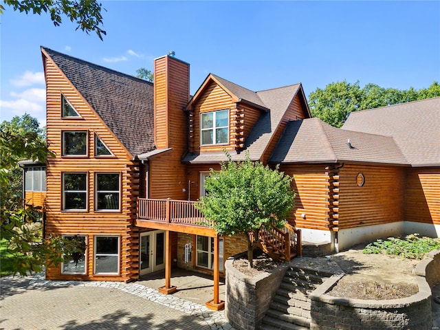 6800 Promise Pt, House Springs, MO 63051 - rear view of house with a chimney, log exterior, a patio area, french doors, and a wooden deck