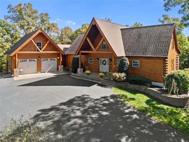 6800 Promise Pt, House Springs, MO 63051 - cabin featuring driveway, a garage, and roof with shingles