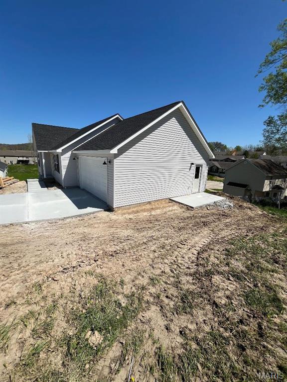 view of home's exterior featuring an attached garage