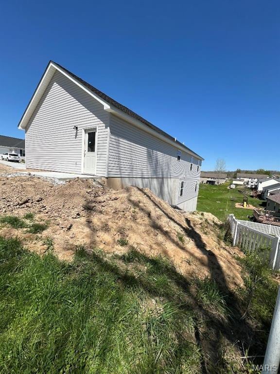 view of side of property with fence